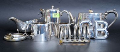 A collection of silver plated wares to include teapot, hot water pot, creamer, sugar bowl,