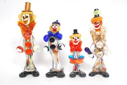 A group of 4 Murano coloured / studio glass clowns to include a large glass clown ,