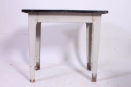 A retro 1950's Industrial metal and enamel top table.