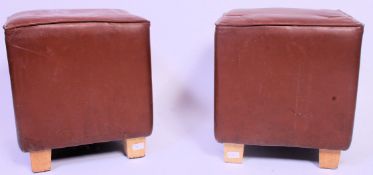 A pair of contemporary brown leather square cafe - bar stools seats,