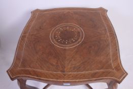 An Edwardian rosewood and marquetry inlaid centre table in the manner of Edwards & Roberts.