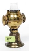 A 19th century most unusual laquered brass small microscope oil lamp, circa 1870.