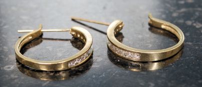 A pair of ladies 9ct gold and diamond ea