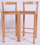 A pair of contemporary beech wood bar st