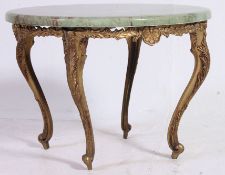 A 1950's gilt metal and onyx coffee tabl