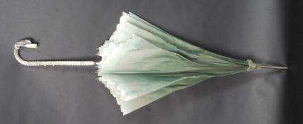 An Edwardian style ladies parasol, profu
