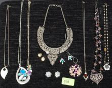 A yellow metal charm bracelet charm seal