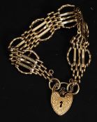 A 9ct gold 6 bar circular gate-link bracelet hallmarked for London with saftey chain.