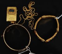 A heavy 9ct gold - metal core rococo chase bangle with safety chain together with a retro quartz