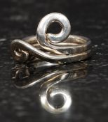 A silver ladies 925 dress ring of crossover swirl form in the modernist style. Size R.