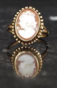 A 9ct gold hallmarked ring with central cameo. Weight 2.8g.