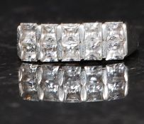 A ladies silver 925 pave set CZ square cut dress ring being claw mounted. Size N.5. 3.