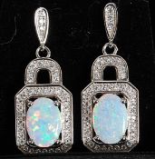 A pair of silver cz stone and opalite inset earrings of square hooped form.
