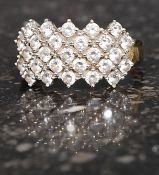 A ladies 14ct gold / 585 marked pave set cocktail dress ring. The clear stones being pave set.