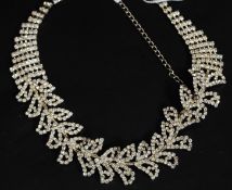 A ladies vintage style diamonte choker necklace inset with multiple square cut stones being claw