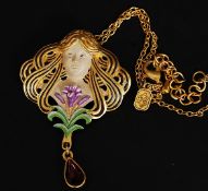 An yellow metal cold painted Art Nouveau pendant necklace in the form of a maiden with teardrop