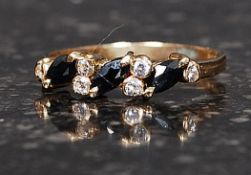 A 9ct gold / 375 marked ladies ring with inset diamonds approx 12 pnts. Size O. Total weight 1.