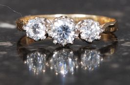 A 9ct hallmarked gold ring set with three CZ stones. Weight 1.4g.