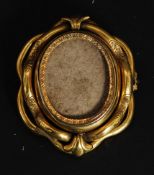A Victorian pinchbeck yellow metal swivel brooch - hair locket.