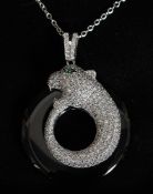 A silver ladies 925 panther necklace with emerald eyes set on chain. 14.