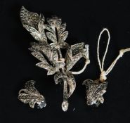 A ladies marcasite vintage brooch and earring set.