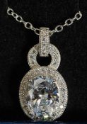 A ladies silver and Cz stone inset pendant on necklace of hooped form. 4.