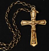 A 9ct gold crucifix pendant set on 375 marked chain linked necklace Total weight.8.