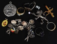 A silver charm bracelet to include charms such as shells, animals, horse and cart etc.
