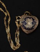 An Italian 9ct gold necklace with a yellow metal and silver enamel set hair locket. Total weight 4.