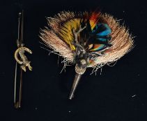 A Scottish white metal stag and partridge plume feather brooch.