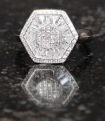 A ladies contemporary hexagonal head silver and cz stone inset dress ring. Total weight 4.9g .