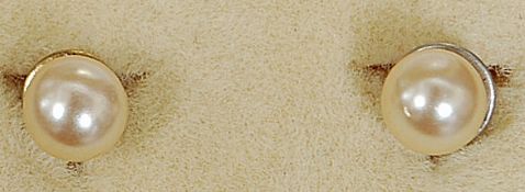 A pair of 9ct gold and simulated Lotus pearl stud earrings in presentation case. Total weight 1.