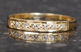 An 18ct gold and diamond ladies half eternity ring having channel set 7 diamonds approx 1pnt each.