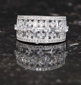 A ladies 925 silver cz stone pave set and cross over cocktail / dress ring. Total weight 7.