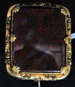 A Victorian pinchbeck brooch set with moss agate in shell and foliate stylised mount.