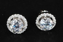 A pair of silver and cz ear studs / earrings.
