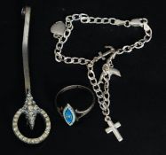 An Italian silver 925 charm bracelet adorned with hearts and dolphins with crucifix's.