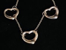 A silver contemporary bracelet with heart shaped links. Stamped 925. 3.