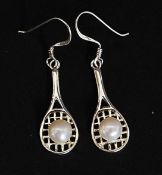 A pair of silver and pearl earrings in the form of tennis rackets and ball. Total weight 2.