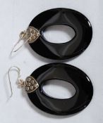 A pair of ladies silver and onyx hooped shaped drop earrings.