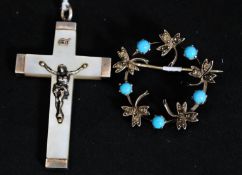 A Victorian turquoise and silver wreath brooch with inset clear stones.