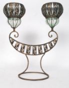 An unusual decorative 20th century Asiatic style cast metal twin candle holder lamp - decorated