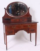 aN Edwardian mahogany dressing table with inlay.