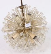 A retro 1970's sputnic / atomic style chandelier having faux crystal adornments.