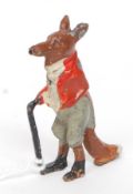 A fabulous lead painted figure of a fox dressed in hunting attire with walking stick.