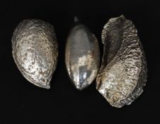 A collection of 3 silver nuts to include brazil nut, Almond and another.