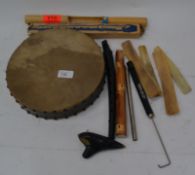 A collection of musical instruments to include an Okarina, Swanee Whistle, Schotts Descant Recorder,