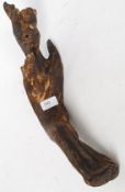 An unusual early 20th century carved hardwood tribal figurine of a Voodoo stick man ( see