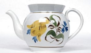 A 19th century pearlware ceramic teapot with hand painted finish complete with lid ( unsigned to