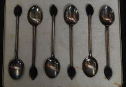 An Edwardian cased set of coffee bean spoons hallmarked for Birmingham, makers mark for H & H,